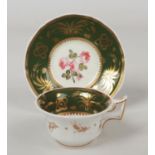 A Rockingham teacup and saucer with square handle. Olive green ground, gilded with wheat and bees