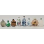 Seven 20th century Chinese decorative snuff bottles. Including three porcelain examples blue and