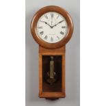A 20th century oak cased regulator wall clock with single train 8 day movement. Having painted