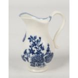 A small Caughley baluster shaped ewer with reeded scroll handle. Printed in underglaze blue with the