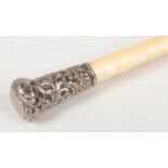 A Victorian parasol with silver pommel and hawthorn carved ivory grip. Assayed Birmingham 1892. Some