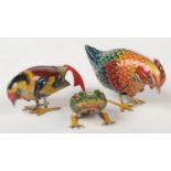 Three German tinplate clockwork toys. Two birds and a frog, largest 9.25cm.