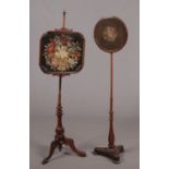 Two Victorian pole screens. Both with floral needlework panels, one carved rosewood and the other