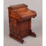 A Victorian burr walnut piano front Davenport writing desk. with rise and fall mechanism, 88cm
