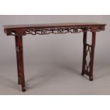 A 19th century Chinese hardwood alter table with openwork frieze, 41cm x 175cm, 106cm high. Top