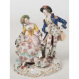 An early 20th century Naples figure group of a courting lady and gent. Coloured in enamels and