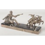 An Art Deco silvered bronze figure group depicting Diana the Huntress. Raised on a two tone veined