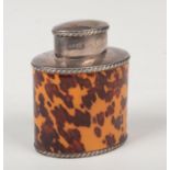 A Victorian silver tea jar and cover with tortoiseshell mounts and gadrooned rims by Atkin Brothers.