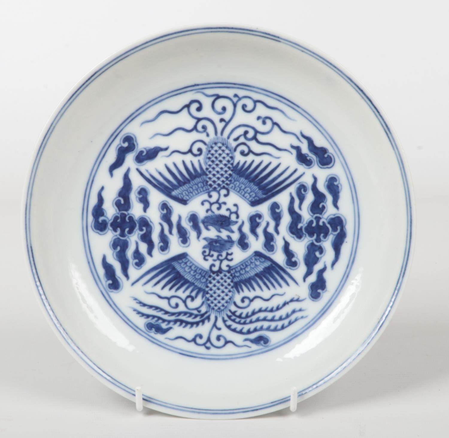 A Chinese Kangxi (1662-1722) blue and white Phoenix dish. Painted in underglaze blue with a pair