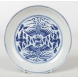 A Chinese Kangxi (1662-1722) blue and white Phoenix dish. Painted in underglaze blue with a pair