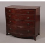 An early 19th century mahogany bow fronted chest of drawer. Possibly American, with chestnut