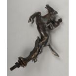 A vintage Desmo chromium plated horse and jockey car mascot, 18cm including nut. Tarnished and