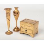 A Japanese Meiji period lacquer jewellery casket and two similar ikebana vases. Gold ground, the