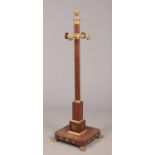 A 19th century mahogany hat and coat stand.With ormolu mounts having urn finial, mask pegs and