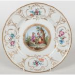 A 20th century Meissen cabinet plate with moulded border decorated in gilt and with flower sprays.