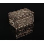 A Chinese export silver small rectangular box with hinged cover. Decorated in relief on textured