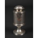 A Georgian silver pepperette of pedestal form and of heavy gauge. With reeded bands and inscribed