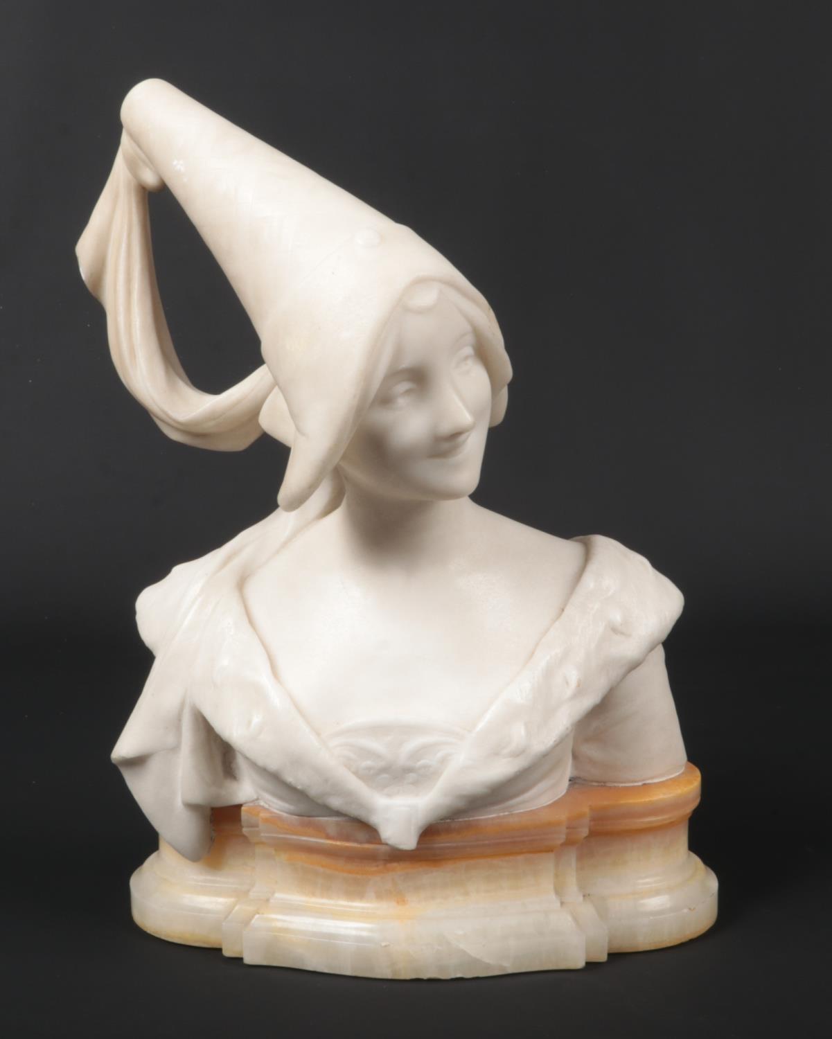 After Giuseppe Bessi, a carved marble bust of a medieval Princess raised on a yellow onyx plinth,