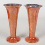 A pair of Wedgwood dragon lustre trumpet shaped vases by Daisey Makeig-Jones. Orange ground and each