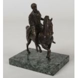 An early 20th century French patinated bronze equestrian figure of a Romanesque man and steed raised