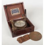 A mahogany cased brass compass with silvered dial signed John Davis & Son, Derby. No. 4122, 13.