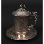 An Ottoman silver sahlep cup, cover and stand. With bird finial, double scrolling handle with bird