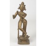An 18th century Indian bronze figure of a deity raised on a lotus plinth, 23cm. Figures right hand