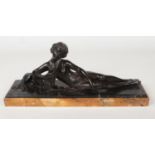 An Art Deco patinated bronze sculpture of a reclining maiden and an Afghan hound. Raised on a