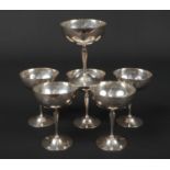 A set of six George V silver champagne saucers by Goldsmith's & Silversmith's Co. Ltd. Engraved with