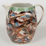 A large pearlware mocha jug of barrel form. With reed moulded collar and marbleised slip glaze c.
