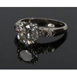 An 18 carat white gold brilliant cut solitaire diamond ring. With a four double claw setting and