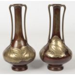 A pair of Japanese Meiji period bronze overlay twin handled vases of tall slender form. Decorated in