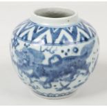 A Chinese Wanli (1573-1619) blue and white jar. Painted in underglaze blue with a continuing