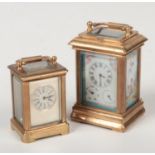 Two miniature brass cased carriage clocks. The smallest with a silvered dial mask, the other