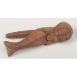 An early 20th century Continental carved wood nut cracker formed as an old woman, 21.25cm. Good