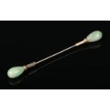 A French 18 carat gold jabot pin. With jadeite terminals and set with rose cut diamonds. Eagles head