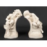 A large pair of Victorian Parian sculptures modelled as children sleeping on chairs. Left white