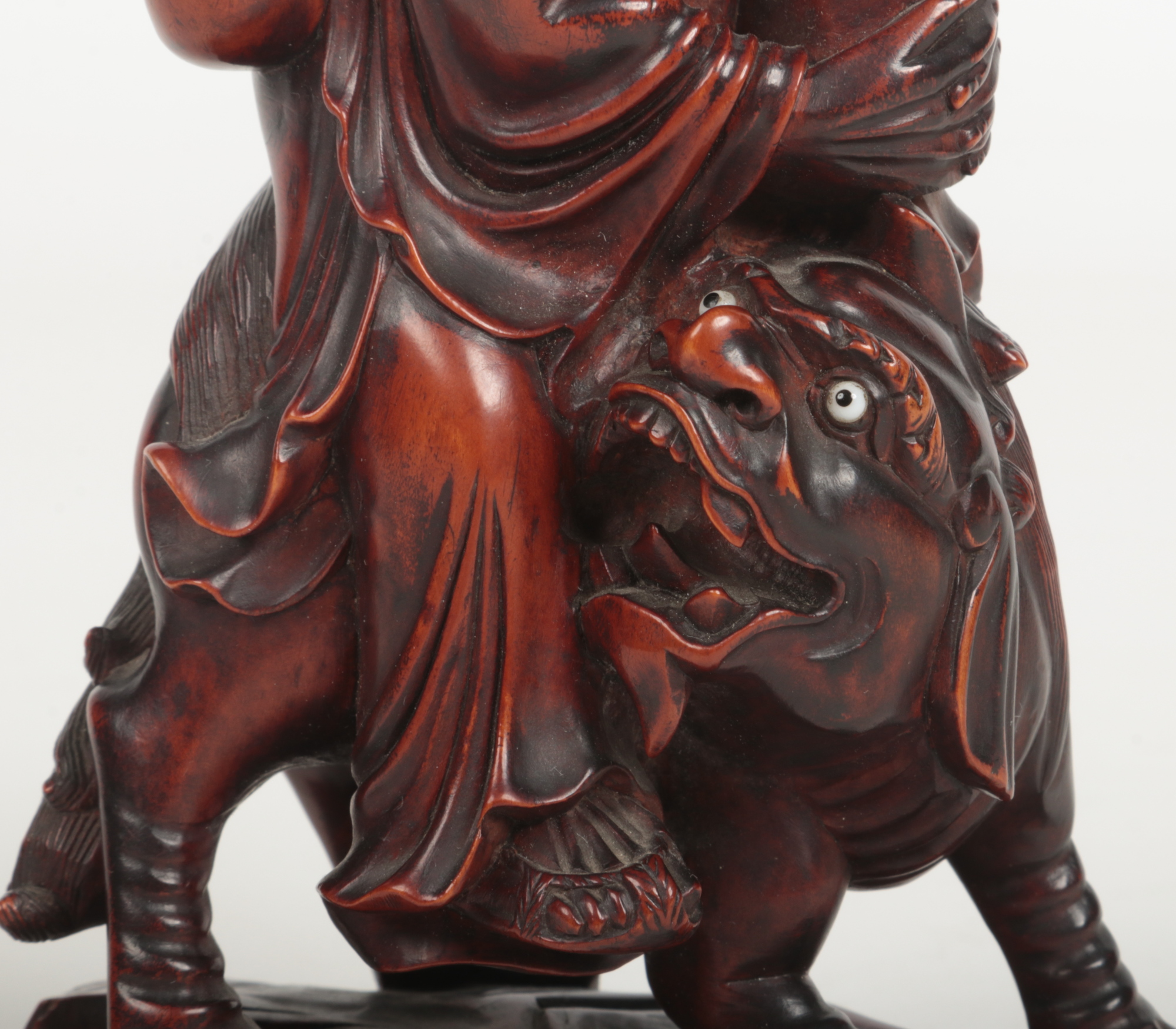 A 19th century Chinese carved wood figure of a man mounted upon a lion dog. With glass inset eyes - Image 5 of 7