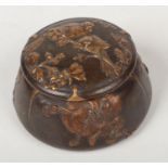 A French Art Nouveau parcel gilt bronze pot and cover. Decorated in relief with birds and flowers,