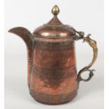 A 19th century Turkish brass and copper jug with hinged cover, 30cm. Good condition.