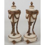 A pair of 19th century French Neo-Classical style marble and gilt bronze casolettes. Ornamented with