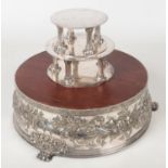 A George V silver plated wedding cake stand and pair of associated tiers. The main stand chased with