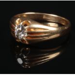 A gentleman's 18 carat gold solitaire diamond ring. Set with an oval old cut diamond 5mm x 4mm, 4.