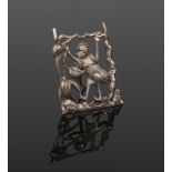 A Chinese silver menu or place name holder of easel form. Decorated with a monkey swinging from