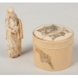 A Japanese Meiji period ivory cylindrical jar and cover carved with an elephant, lion and monkeys