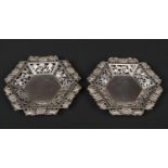 A pair of Chinese hexagonal silver waiters. Pierced with panels of bamboo shoots and prunus