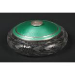 An Art Deco cit glass powder bowl with silver rim and cover by Albert Carter. The silver embellished