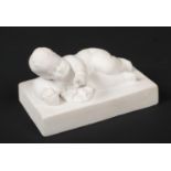 A Rockingham biscuit figure from a series of four studies of an infant sleeping and awakening.