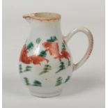 An 18th century Chinese export baluster cream jug with loop handle. Painted in coloured enamels with