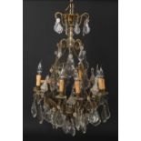 An early-mid 20th century French gilt metal and cut crystal eight branch chandelier, 90cm drop, 50cm